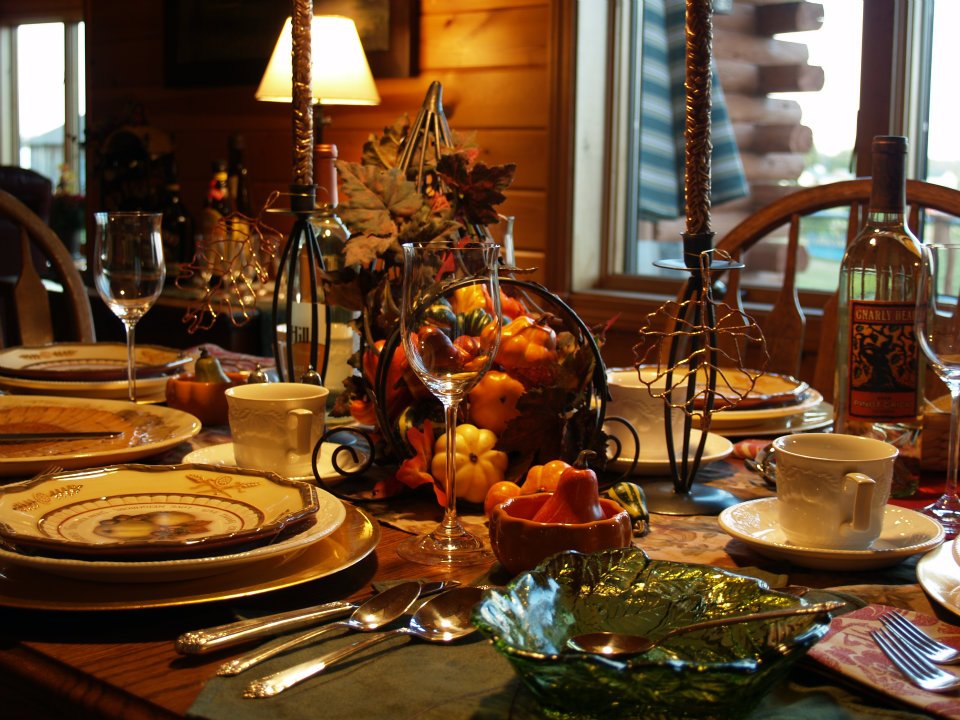 Dining table set with china for Thanksgiving dinner.